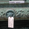 This is a close-up view before conservation treatment exhibiting the severe black appearance, matte, opaque sulfide crust on the surface of the sculpture fountain.