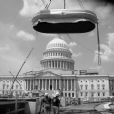 The 2nd South cast bronze fountain is lowered to the site location to be anchored in place