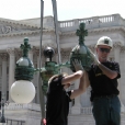 ART technicians dismantling and removing the cast bronze lamp fixtures in preparation for shipping