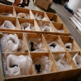 Lamp fixture sections are packaged in wooden crates for return shipment to the U S Capitol and then assembled on site.