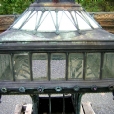 This is a photo of one of the Chinese cast bronze lantern before conservation and restoration. Notice the missing German cut glass panels.