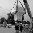 Here the technicians are attaching stainless steel pins to the new stainless anchoring system in the interior of the Chinese cast bronze lamps.