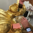Applying gold leaf to the Union Soldier monument