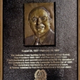 Sculptured relief portrait of Fred Kochel. Lost wax bronze cast with a hot chemical patina and script that is high polished