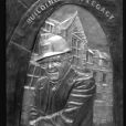 Sculpted lost wax cast portrait plaque in memory of George Rakoczy with hot chemical patina and polished letters